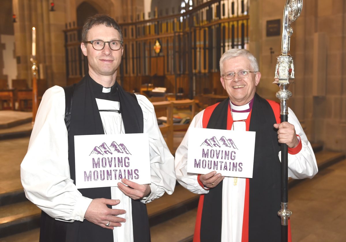 Bishop Philip and Bishop Julian, proudly displaying they support Moving Mountains